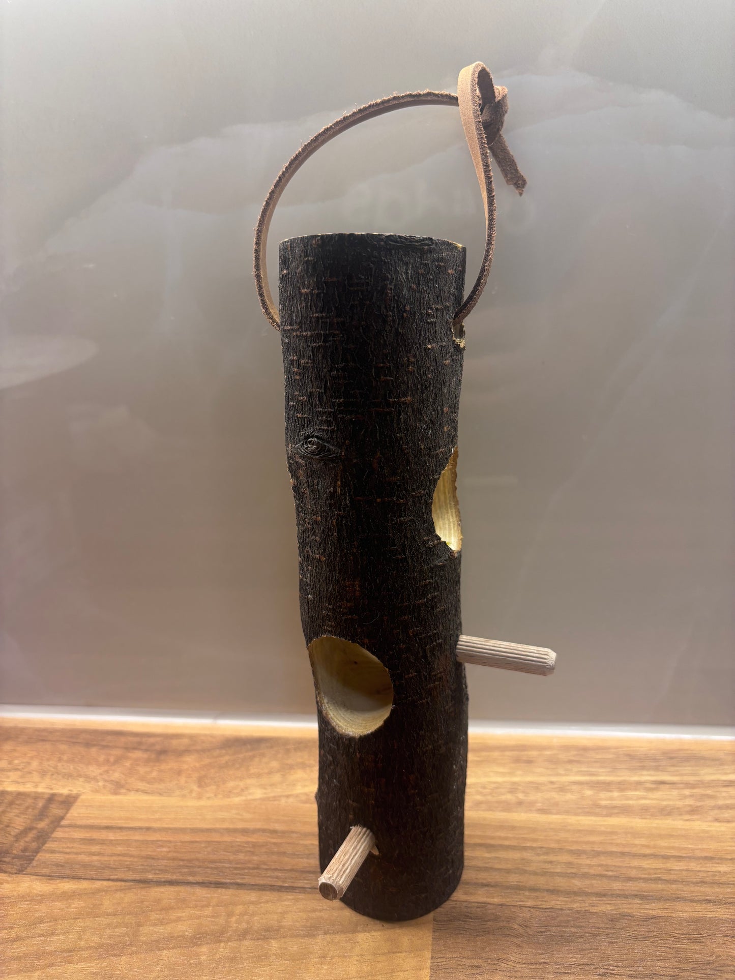 Handmade suet log bird feeder for feeding garden birds in wildlife gardens