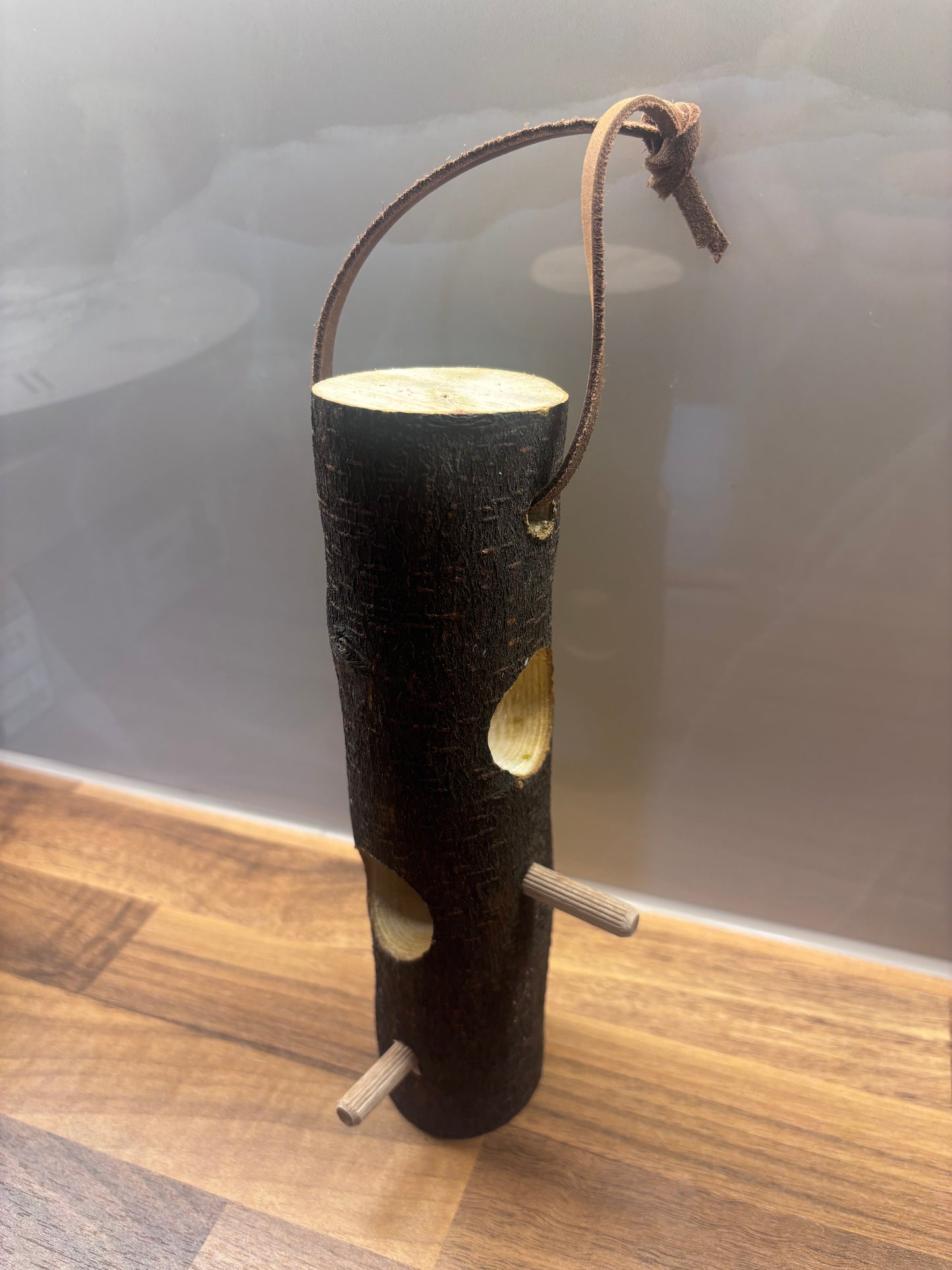 Handmade suet log bird feeder for feeding garden birds in wildlife gardens